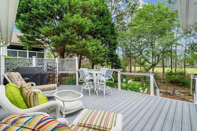 3193 Wexford Way, Southport, NC 28461 - wooden terrace with outdoor dining space and area for grilling