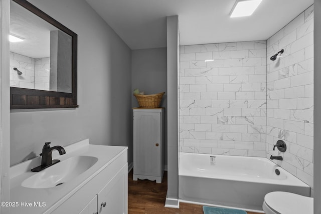 10378 Neuse Rd, Grantsboro, NC 28529 - full bath featuring wood finished floors, vanity, toilet, and shower / bathtub combination