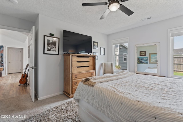 2824 Sapling Cir, Wilmington, NC 28411 - bedroom featuring light carpet, a textured ceiling, baseboards, and a ceiling fan
