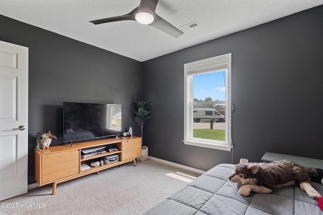 2824 Sapling Cir, Wilmington, NC 28411 - bedroom with light carpet, a textured ceiling, and ceiling fan