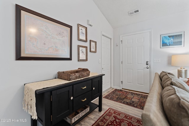 2824 Sapling Cir, Wilmington, NC 28411 - entryway featuring vaulted ceiling and light wood finished floors