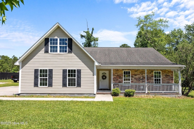 301 Haws Run Rd, Jacksonville, NC 28540 - traditional-style home with a porch, a front yard, and stone siding