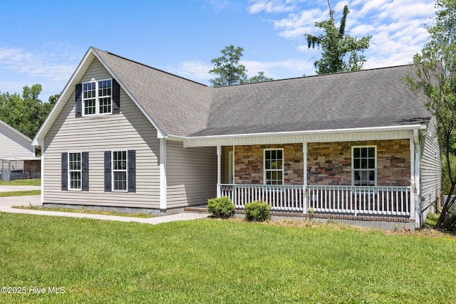 301 Haws Run Rd, Jacksonville, NC 28540 - view of front of property with a front lawn, a porch, roof with shingles, and stone siding