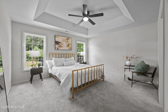 301 Haws Run Rd, Jacksonville, NC 28540 - bedroom with a raised ceiling, baseboards, carpet flooring, and a ceiling fan