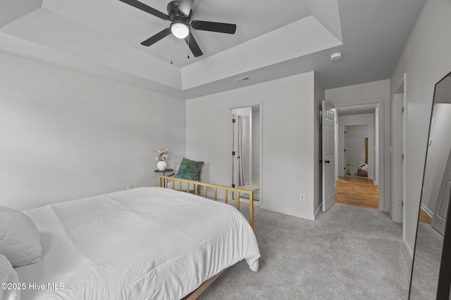 301 Haws Run Rd, Jacksonville, NC 28540 - carpeted bedroom with a raised ceiling, baseboards, and ceiling fan