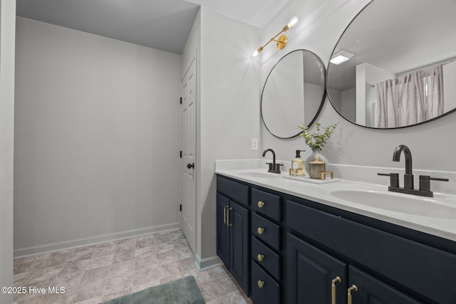 301 Haws Run Rd, Jacksonville, NC 28540 - bathroom with double vanity and baseboards