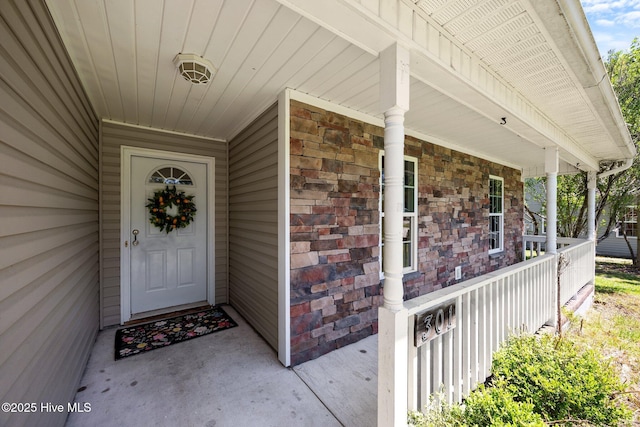 301 Haws Run Rd, Jacksonville, NC 28540 - doorway to property with covered porch and stone siding