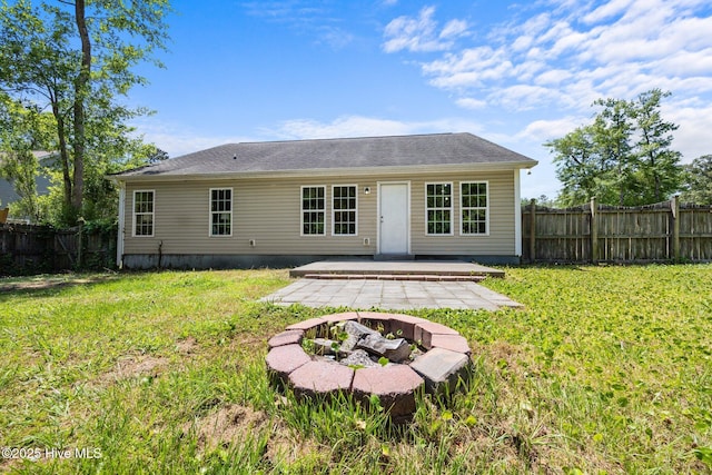 301 Haws Run Rd, Jacksonville, NC 28540 - rear view of property with an outdoor fire pit and a patio area