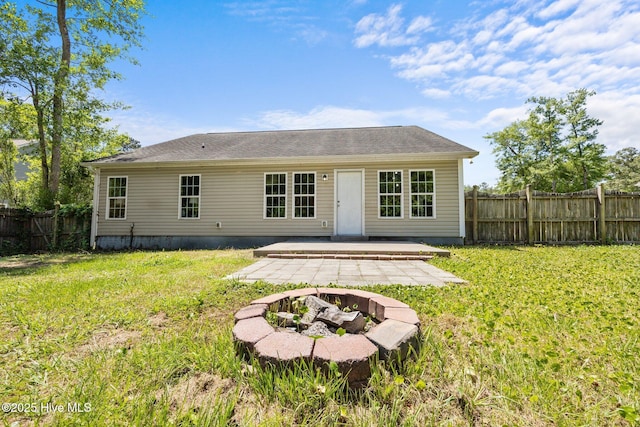 301 Haws Run Rd, Jacksonville, NC 28540 - rear view of house featuring a patio and an outdoor fire pit