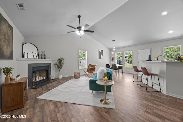 301 Haws Run Rd, Jacksonville, NC 28540 - living area featuring dark wood-style flooring, lofted ceiling, a fireplace, baseboards, and recessed lighting