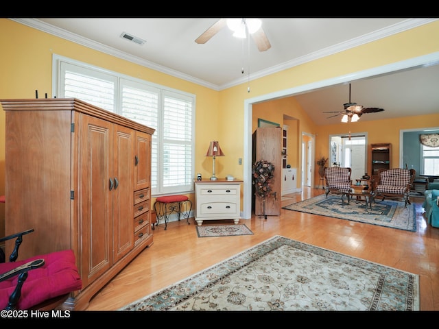 1133 Grandiflora Dr, Leland, NC 28451 - living room with a ceiling fan, light wood-style flooring, healthy amount of natural light, and ornamental molding