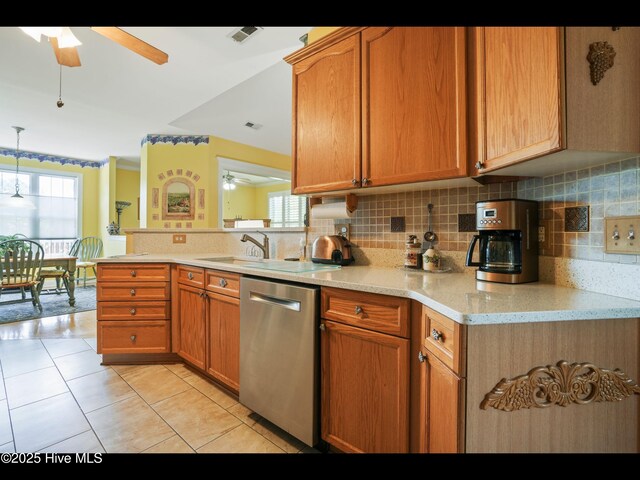 1133 Grandiflora Dr, Leland, NC 28451 - kitchen with dishwasher, a ceiling fan, tasteful backsplash, and plenty of natural light