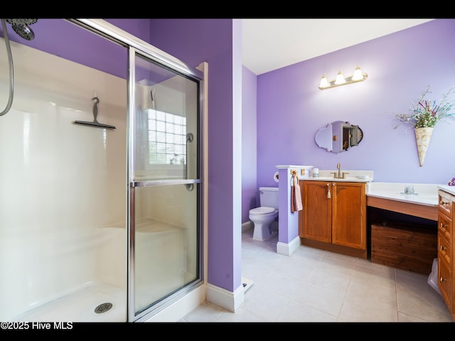 1133 Grandiflora Dr, Leland, NC 28451 - bathroom with vanity, a stall shower, tile patterned floors, toilet, and baseboards