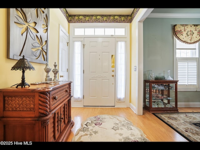 1133 Grandiflora Dr, Leland, NC 28451 - foyer with light wood finished floors, crown molding, and baseboards