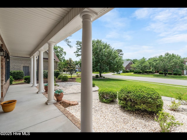 1133 Grandiflora Dr, Leland, NC 28451 - covered porch with a yard