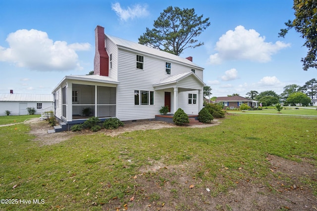 257 Evans-Bass Rd, Edenton, NC 27932 - view of front facade with a chimney, a sunroom, and a front yard