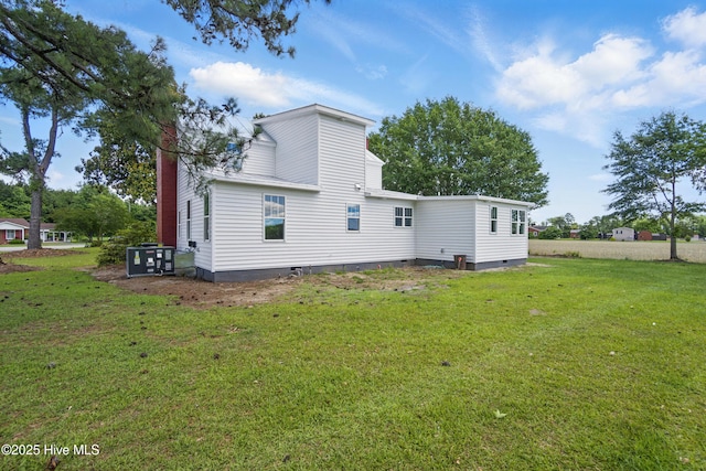 257 Evans-Bass Rd, Edenton, NC 27932 - back of property with crawl space, a lawn, and central AC unit