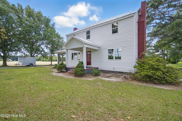 257 Evans-Bass Rd, Edenton, NC 27932 - view of front of home featuring a chimney, a front yard, crawl space, and metal roof