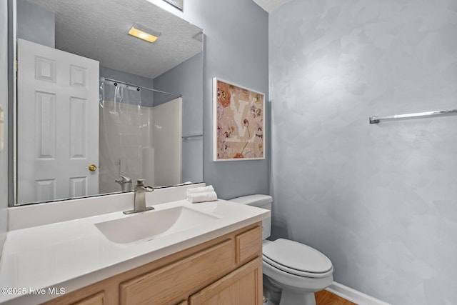 100 Hedingham Ct, Wilmington, NC 28412 - bathroom with toilet, vanity, a shower with curtain, a textured ceiling, and baseboards