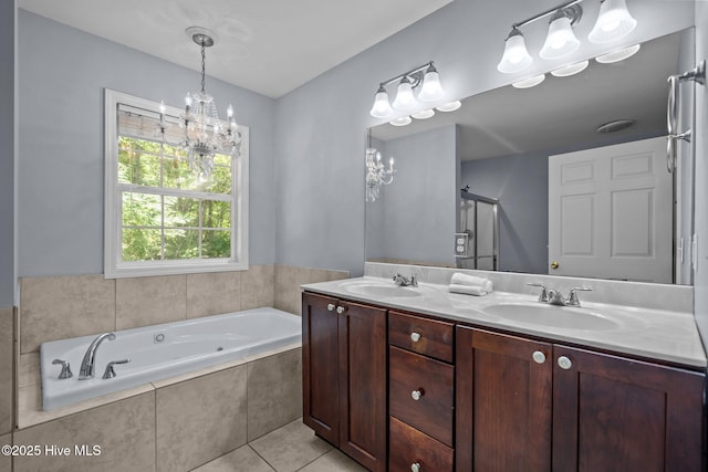 100 Hedingham Ct, Wilmington, NC 28412 - bathroom with double vanity, a jetted tub, tile patterned floors, a chandelier, and a shower with door