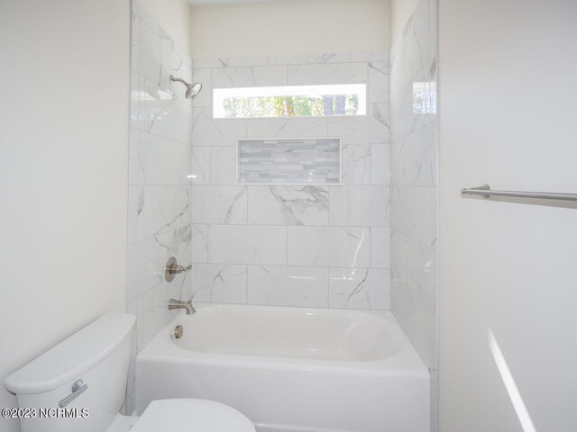 335 NE 41st St, Oak Island, NC 28465 - bathroom with toilet and shower / washtub combination