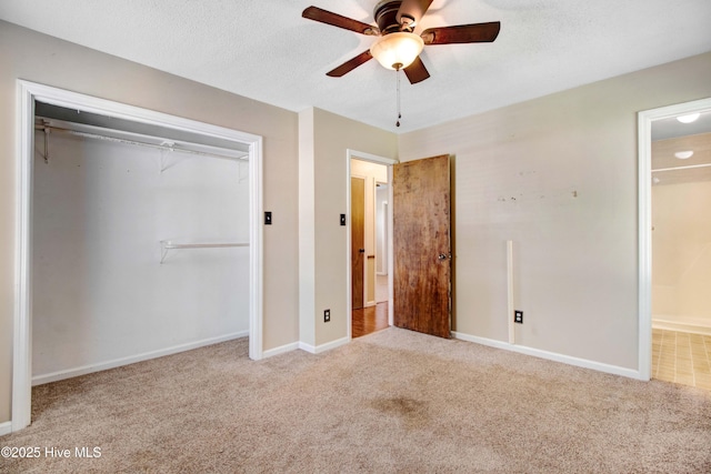 287 Perkins Rd, Goldsboro, NC 27530 - unfurnished bedroom with carpet flooring, a closet, baseboards, ceiling fan, and ensuite bath