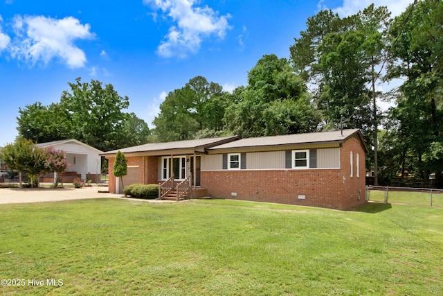 287 Perkins Rd, Goldsboro, NC 27530 - single story home with crawl space, an attached garage, brick siding, and concrete driveway