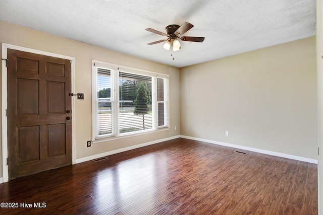 287 Perkins Rd, Goldsboro, NC 27530 - entryway featuring a ceiling fan, dark wood-style flooring, baseboards, and a textured ceiling