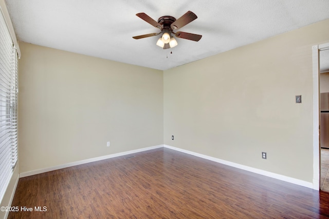 287 Perkins Rd, Goldsboro, NC 27530 - empty room featuring ceiling fan, dark wood-type flooring, and baseboards