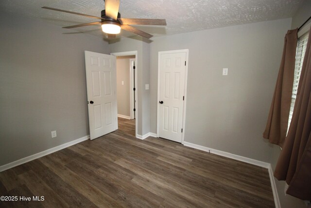 114 Pinecone Ln, Havelock, NC 28532 - unfurnished bedroom featuring wood finished floors, baseboards, a textured ceiling, and ceiling fan