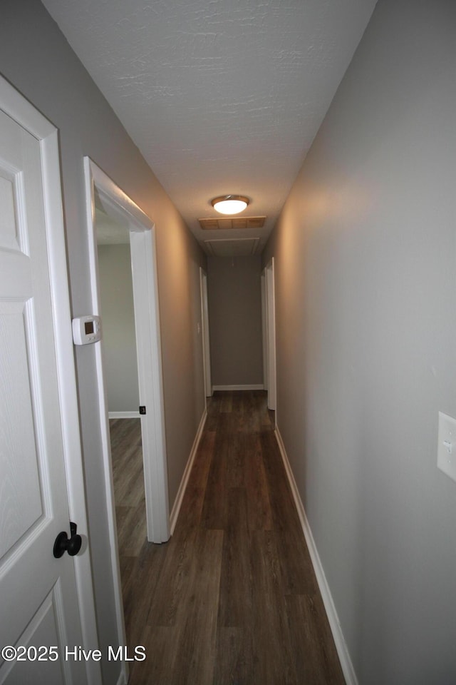 114 Pinecone Ln, Havelock, NC 28532 - hall featuring wood finished floors, baseboards, and attic access