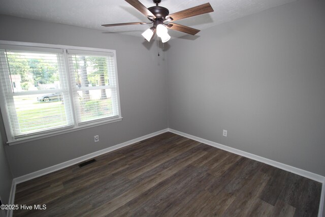 114 Pinecone Ln, Havelock, NC 28532 - unfurnished room featuring dark wood-style flooring, ceiling fan, and baseboards
