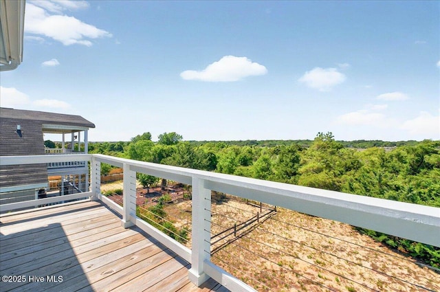 256 Brunswick Ave W Unit A, Holden Beach, NC 28462 - wooden deck with a wooded view