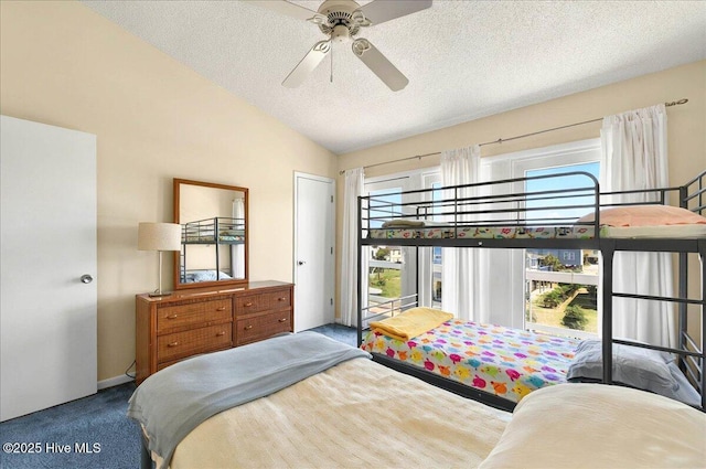 256 Brunswick Ave W Unit A, Holden Beach, NC 28462 - carpeted bedroom with lofted ceiling, a textured ceiling, and a ceiling fan