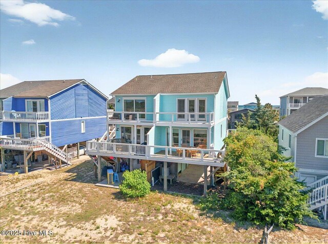 256 Brunswick Ave W Unit A, Holden Beach, NC 28462 - rear view of house with a balcony and stairs