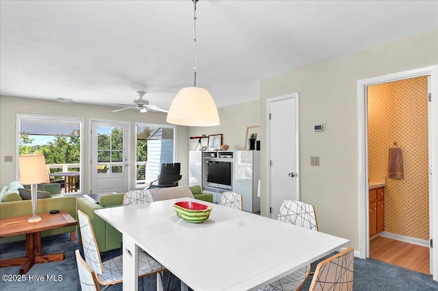 256 Brunswick Ave W Unit A, Holden Beach, NC 28462 - carpeted dining area with a ceiling fan and baseboards