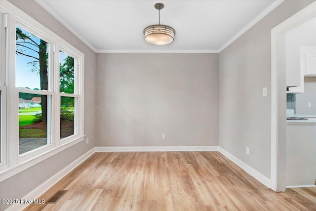 103 Sawgrass Pl, Goldsboro, NC 27534 - unfurnished dining area with light wood-style flooring and ornamental molding