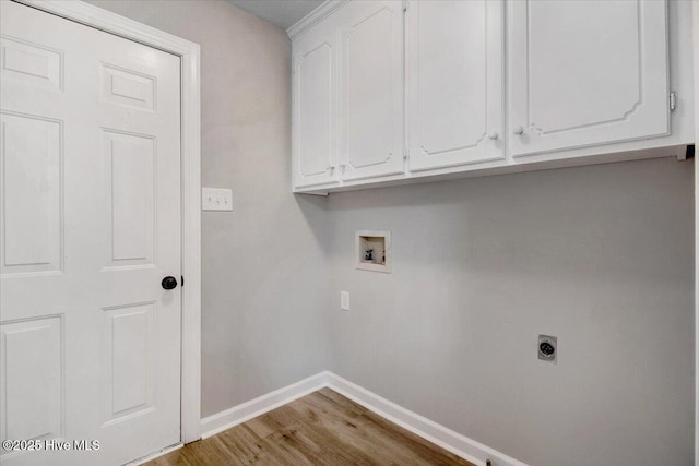 103 Sawgrass Pl, Goldsboro, NC 27534 - laundry room with washer hookup, electric dryer hookup, cabinet space, and wood finished floors