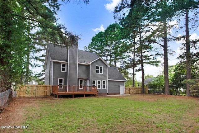 103 Sawgrass Pl, Goldsboro, NC 27534 - rear view of house with a deck, a fenced backyard, roof with shingles, and a chimney