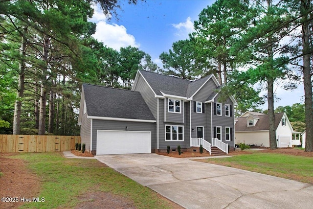 103 Sawgrass Pl, Goldsboro, NC 27534 - view of front facade featuring driveway, an attached garage, and a shingled roof