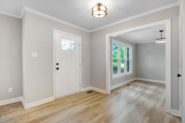 103 Sawgrass Pl, Goldsboro, NC 27534 - entrance foyer featuring plenty of natural light, light wood finished floors, and ornamental molding