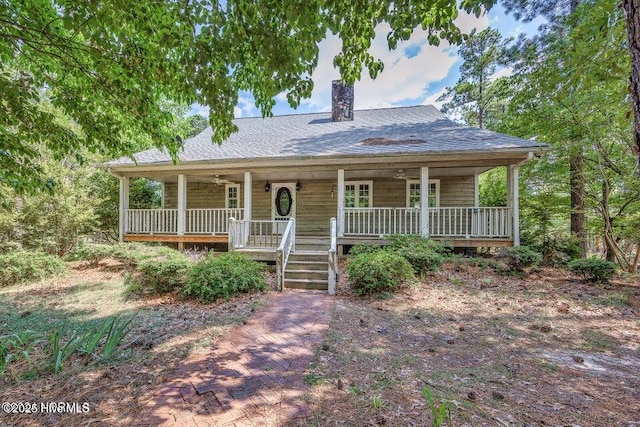 549 Lucas Rd, West End, NC 27376 - view of front of home featuring covered porch, a chimney, and a shingled roof