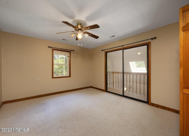 549 Lucas Rd, West End, NC 27376 - empty room with light colored carpet, a ceiling fan, baseboards, and a textured ceiling