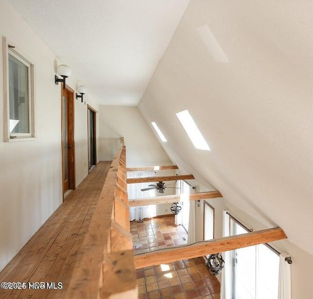 549 Lucas Rd, West End, NC 27376 - stairs with lofted ceiling, a ceiling fan, and a skylight