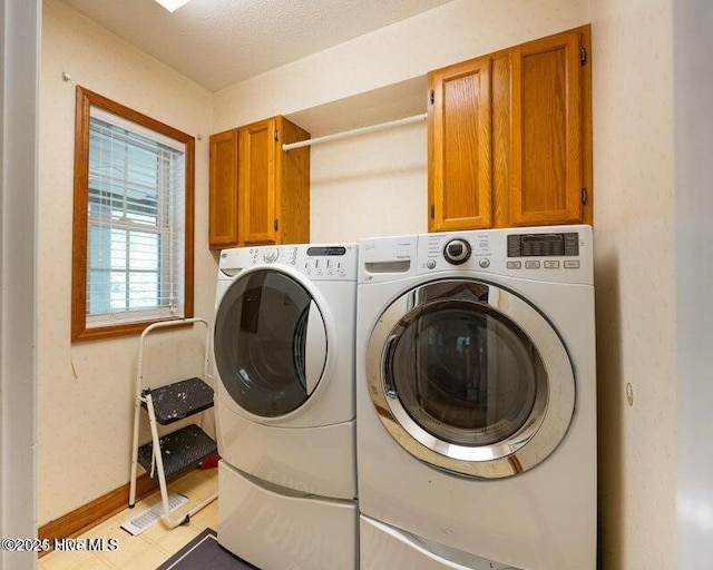549 Lucas Rd, West End, NC 27376 - laundry area with cabinet space, washer and dryer, and baseboards