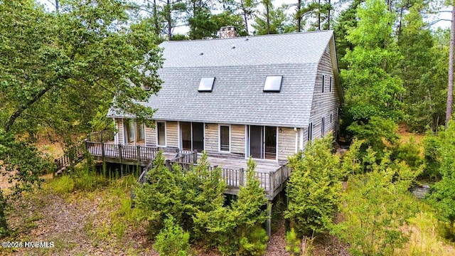 549 Lucas Rd, West End, NC 27376 - dutch colonial featuring a deck, roof with shingles, and a chimney