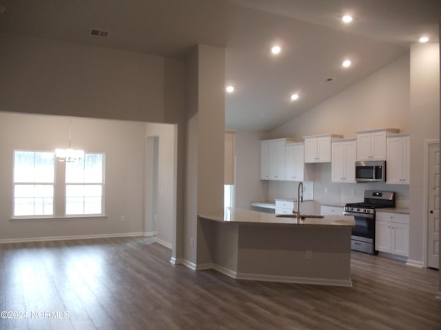 8715 NW Baton Rouge Ave NW Unit 1155-, St Phillips, Calabash, NC 28467 - kitchen with appliances with stainless steel finishes, a sink, high vaulted ceiling, a chandelier, and white cabinetry