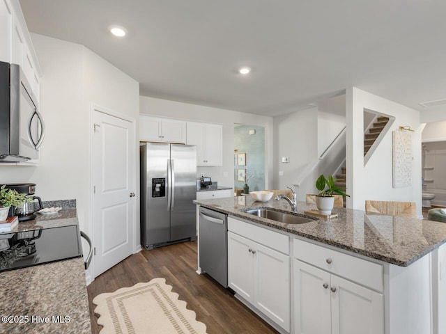 159 Legare St Lot 250, Wilmington, NC 28411 - kitchen featuring stainless steel appliances, a sink, white cabinets, stone counters, and dark wood finished floors