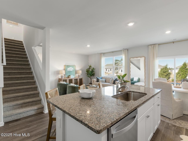 159 Legare St Lot 250, Wilmington, NC 28411 - kitchen with stainless steel dishwasher, a sink, dark wood-type flooring, an island with sink, and white cabinets