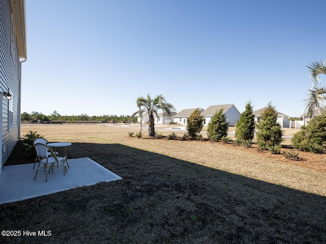 159 Legare St Lot 250, Wilmington, NC 28411 - view of grassy yard featuring a patio